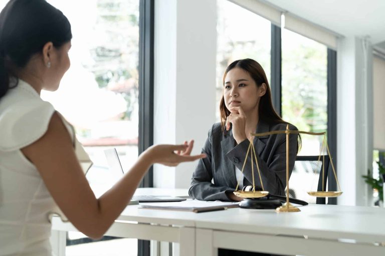 asian female lawyer discussing negotiation legal case with client meeting with document contact in 1