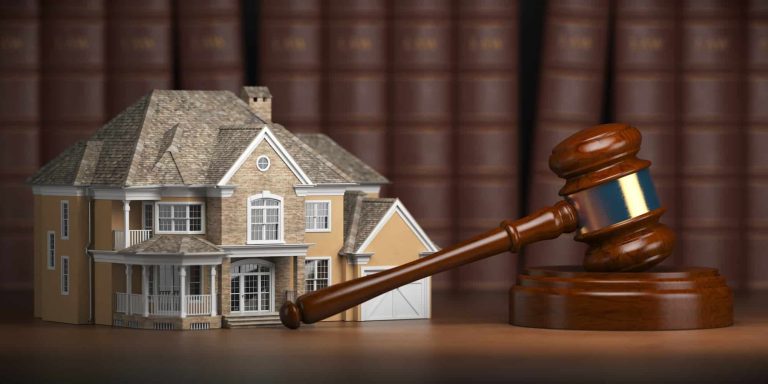house with gavel and law books real estate law and house aucti 1