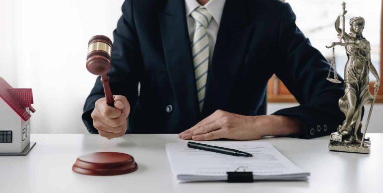 lawyer or judge holding hammer prepares to judge the case with justice and litigation scales of 1