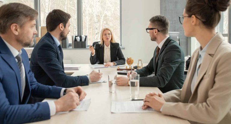 partners of law firm discussing agenda e1666447535340